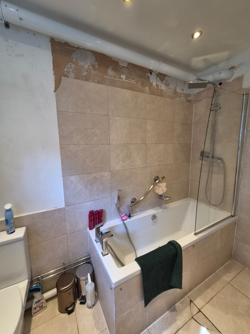 Dated beige tiled bathroom in Shepherd's Bush W12 before renovation by Uz Pro Construction