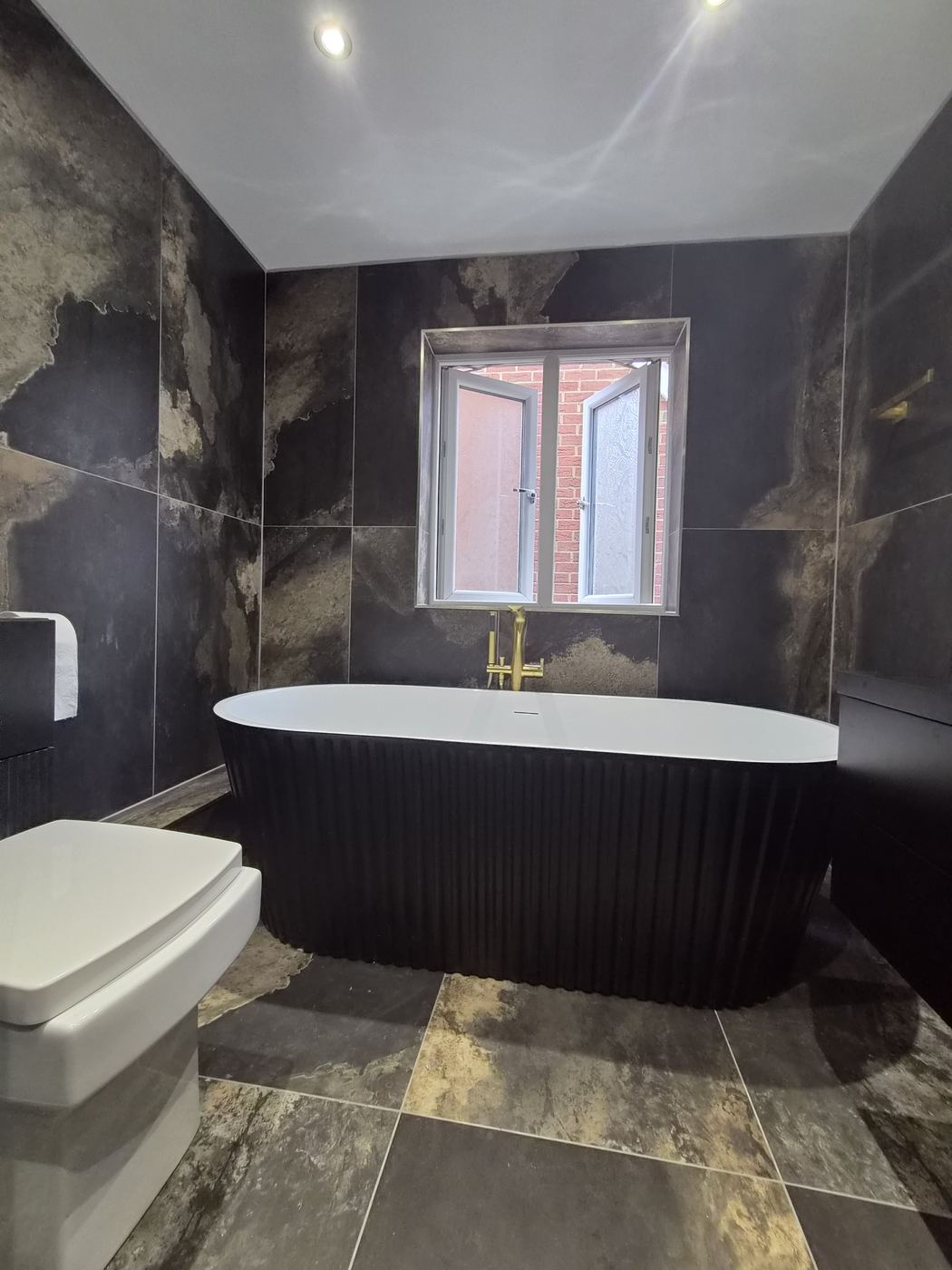 Bathroom renovation in Wembley, HA9 — freestanding bath